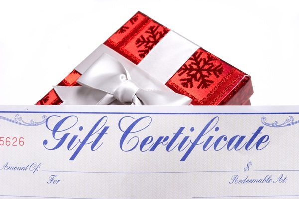 A gifts with bows with a gift certificate over white background