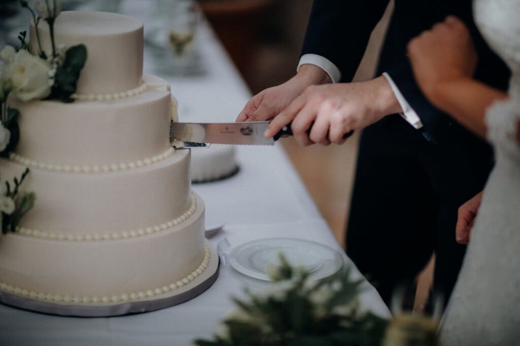 Cake being cut at VE Club wedding